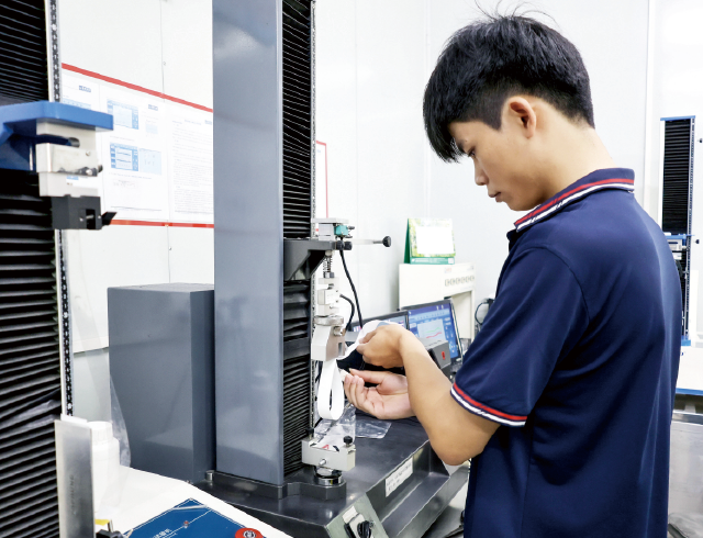 Quality inspector checking self-adhesive label material